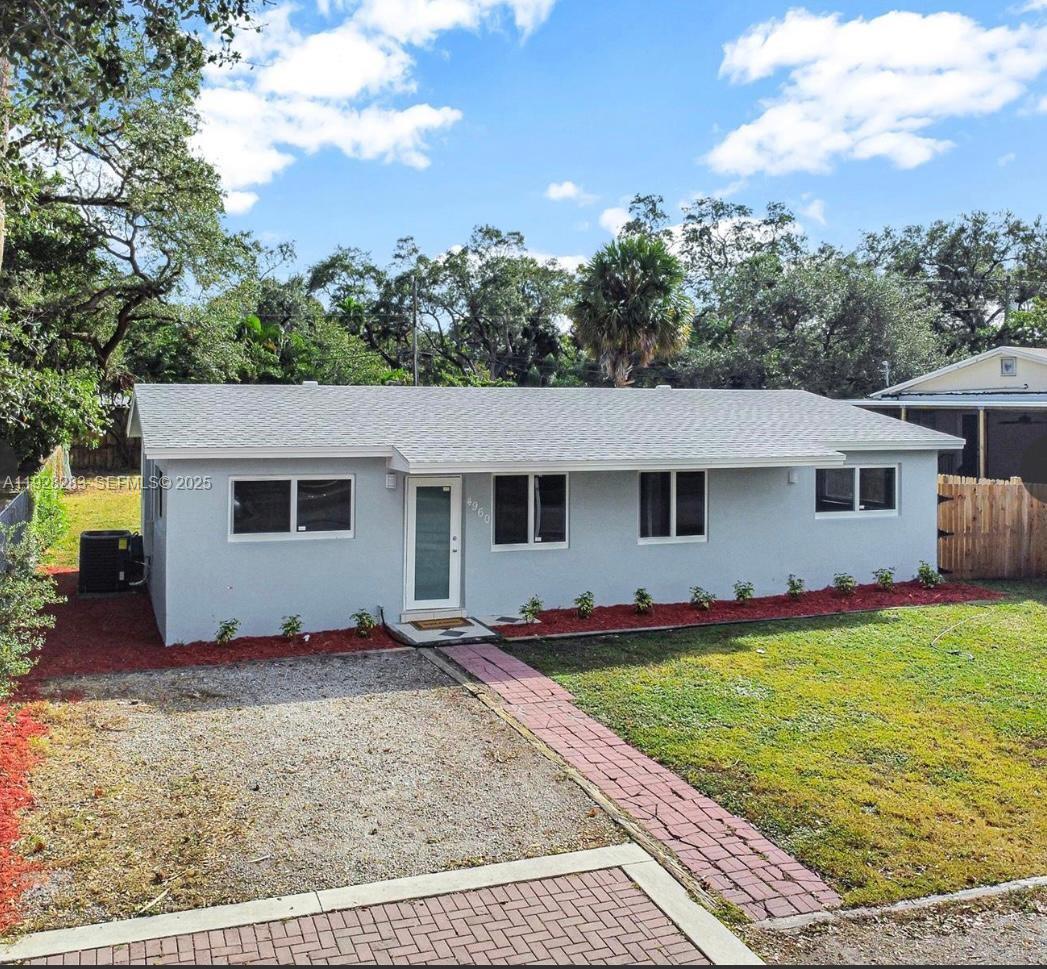 4960 Southwest 28th Terrace Dania Beach, FL 33312 - Photo 1 of 10 a view of a house with a yard