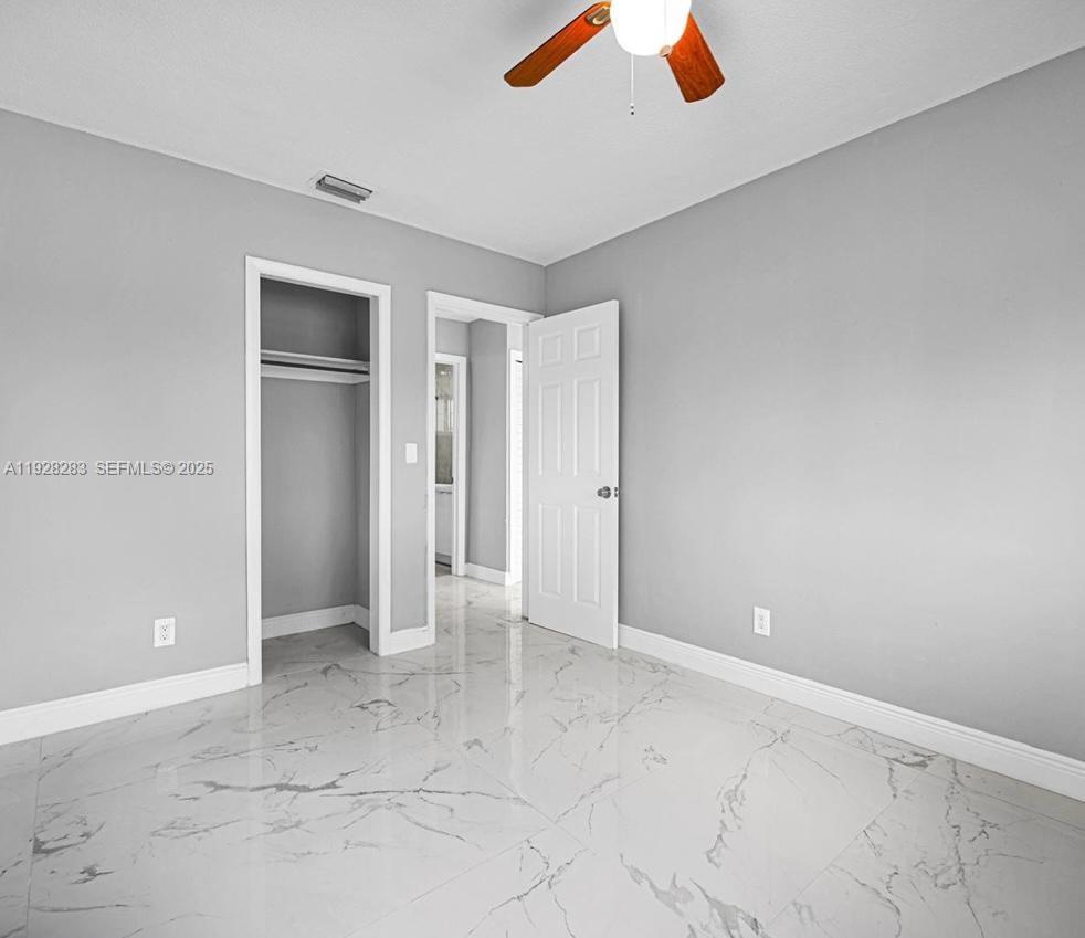 4960 Southwest 28th Terrace Dania Beach, FL 33312 - Photo 8 of 10 wooden floor in an empty room