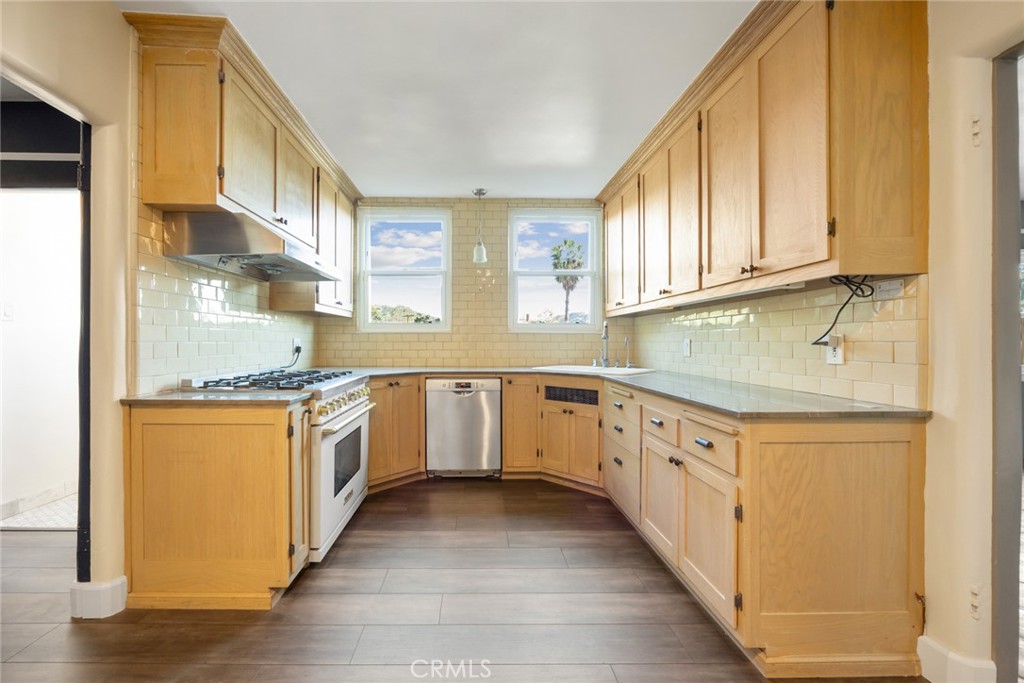 1620 Ina Drive Glendale, CA 91206 - Photo 15 of 31 a kitchen with granite countertop white cabinets and white appliances