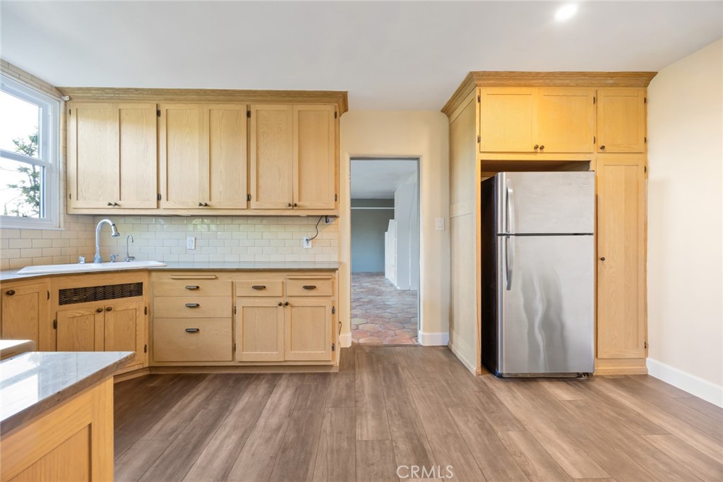 1620 Ina Drive Glendale, CA 91206 - Photo 18 of 31 a kitchen with granite countertop cabinets appliances and a center island