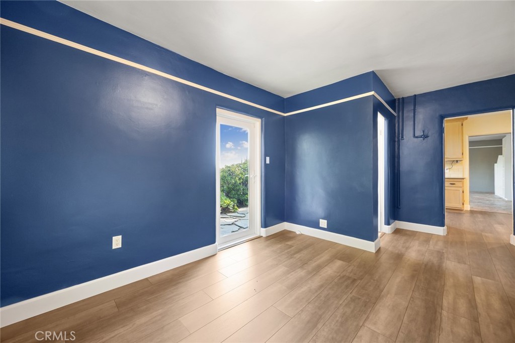 1620 Ina Drive Glendale, CA 91206 - Photo 21 of 31 a view of an empty room with wooden floor and a window