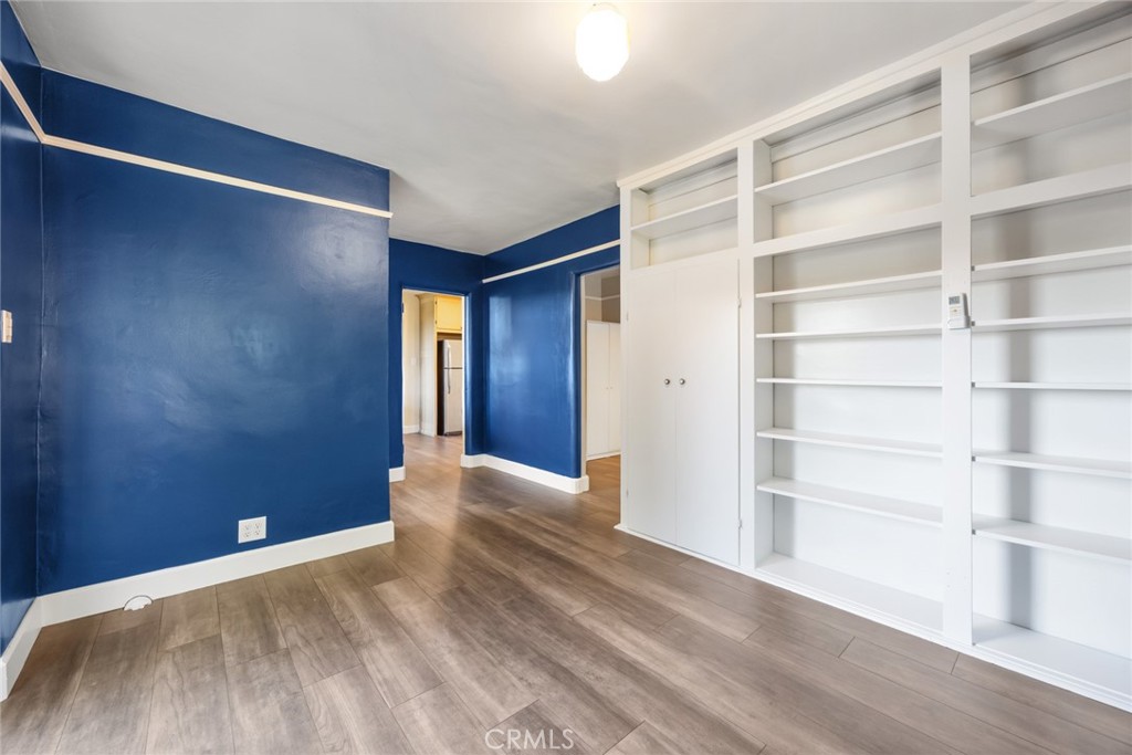 1620 Ina Drive Glendale, CA 91206 - Photo 22 of 31 a view of an empty room with a window and wooden floor