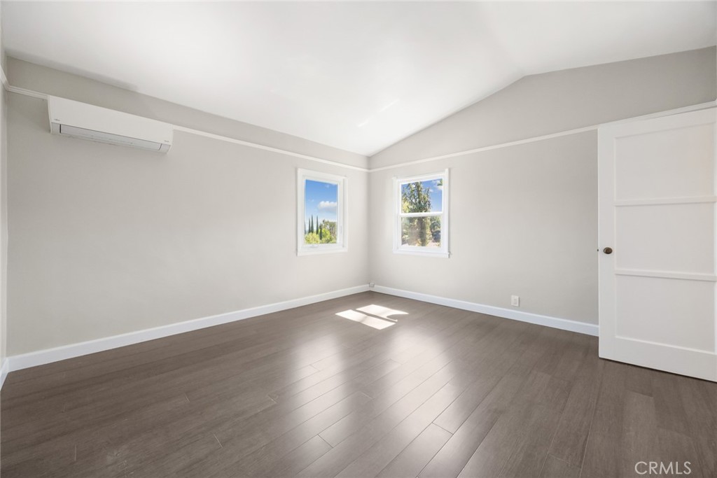1620 Ina Drive Glendale, CA 91206 - Photo 4 of 31 an empty room with wooden floor and windows