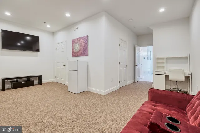 a view of room with cabinet and hallway