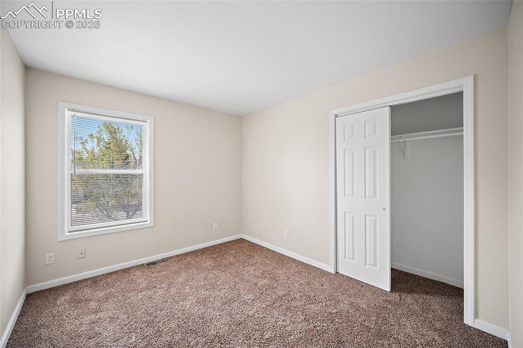 4400 Rawhide Road, Unit 157 Pueblo, CO 81008 - Photo 24 of 36 an empty room with windows and closet