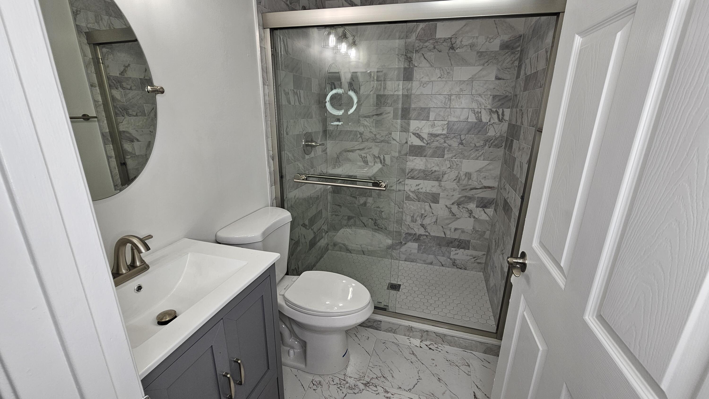 18974 Cloud Lake Circle Boca Raton, FL 33496 - Photo 15 of 29 a bathroom with a sink and a mirror