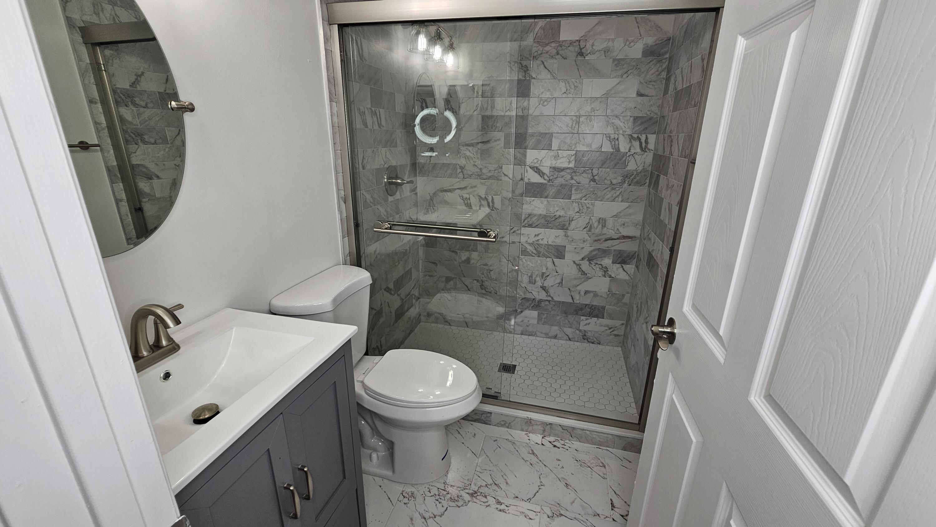 18974 Cloud Lake Circle Boca Raton, FL 33496 - Photo 16 of 29 a bathroom with a sink and a mirror