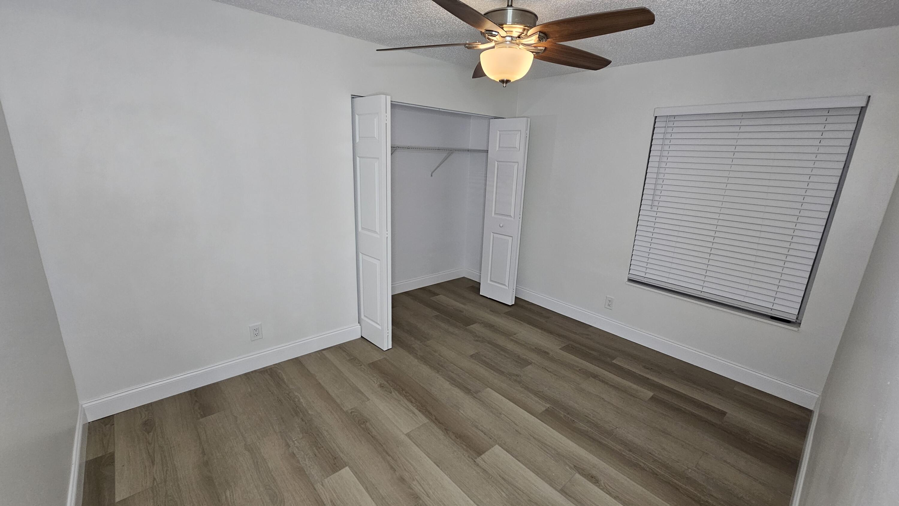 18974 Cloud Lake Circle Boca Raton, FL 33496 - Photo 21 of 29 wooden floor in an empty room