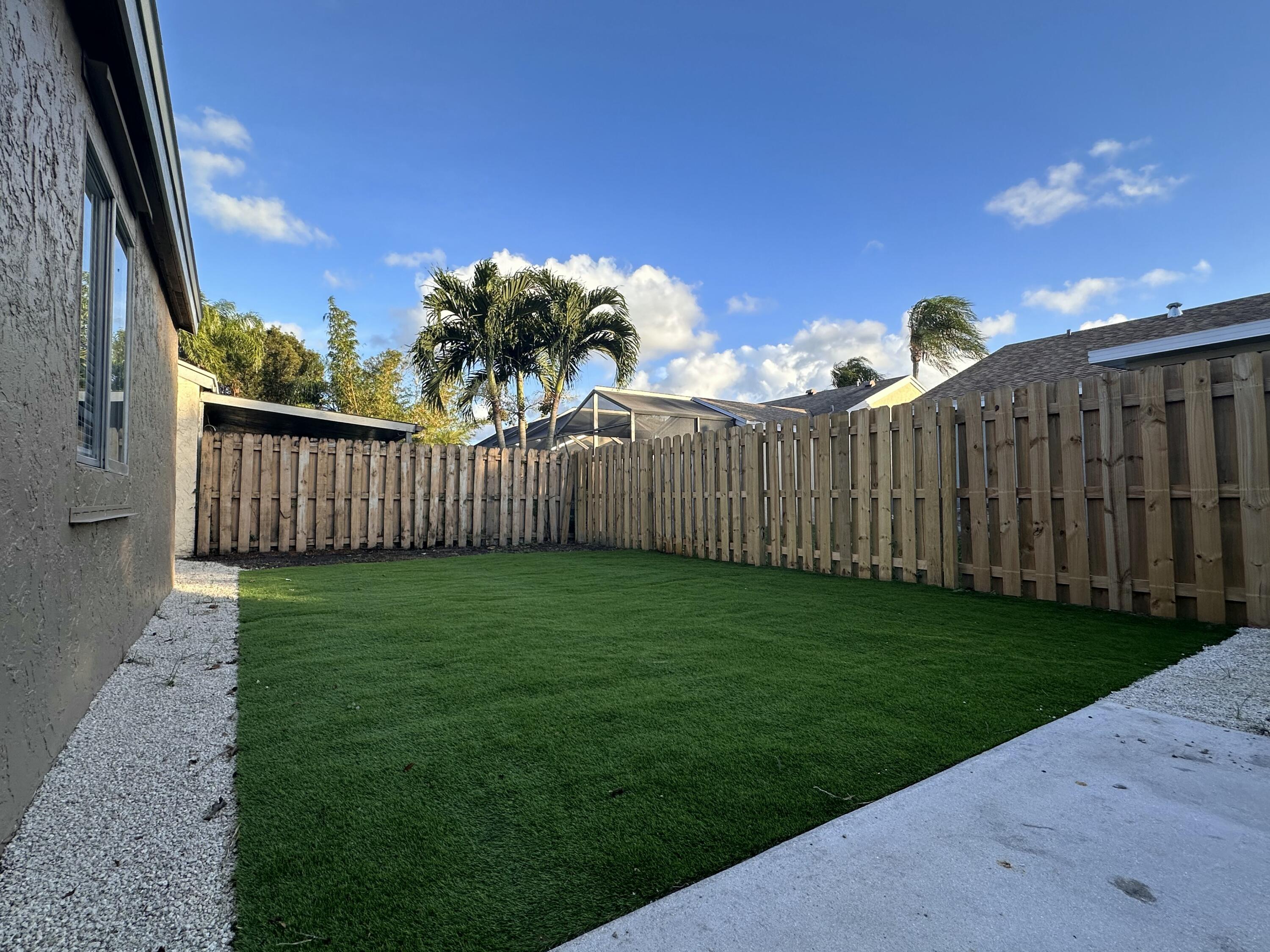 18974 Cloud Lake Circle Boca Raton, FL 33496 - Photo 24 of 29 a view of a wooden fence