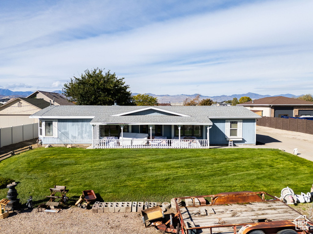 12958 South 300 East Draper, UT 84020 - Photo 29 of 38 Single story home with a mountain view, a shingled roof, and a patio