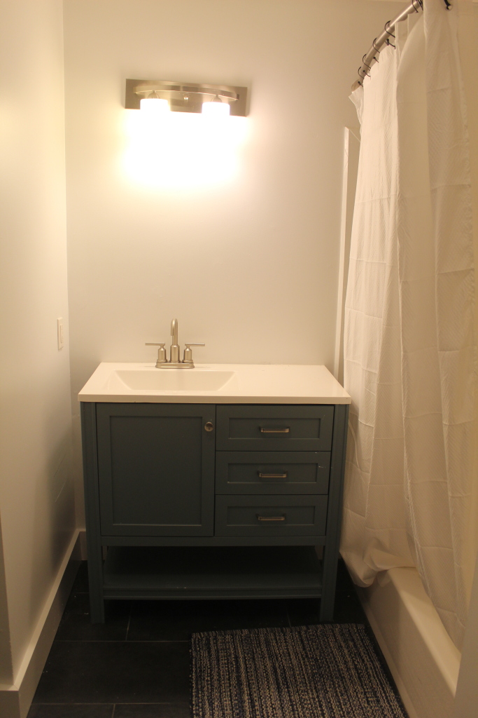 33 Bartlett Road Nantucket, MA 02554 - Photo 21 of 29 a bathroom with a sink and a mirror