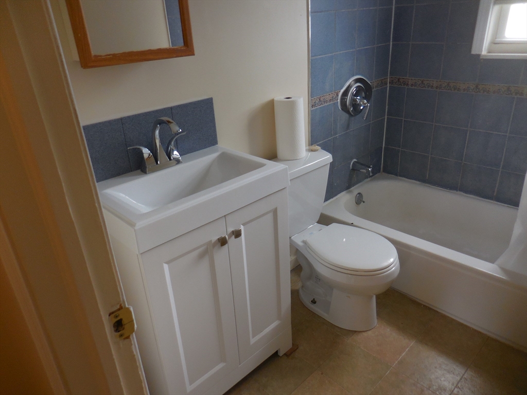 6 Colony Road, Unit 6 West Springfield, MA 01089 - Photo 16 of 17 a bathroom with a sink a toilet and shower