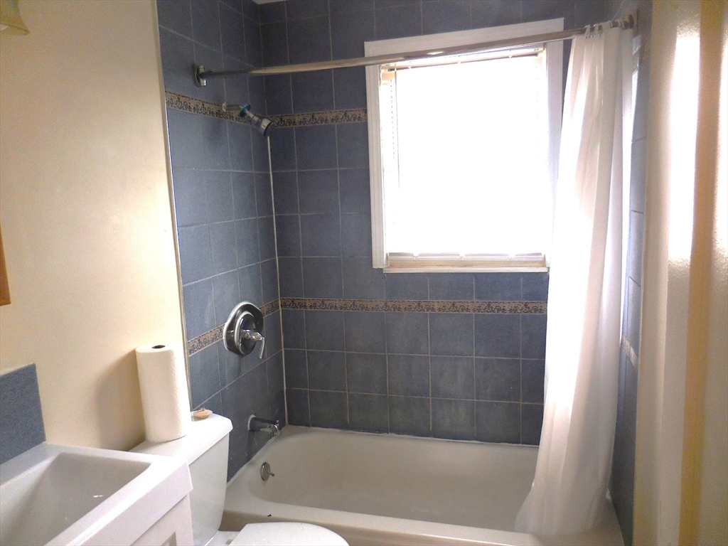 6 Colony Road, Unit 6 West Springfield, MA 01089 - Photo 17 of 17 a bathroom with a bathtub a window and a shower