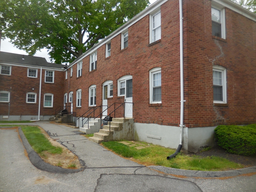 6 Colony Road, Unit 6 West Springfield, MA 01089 - Photo 4 of 17 a front view of a house with garden and patio