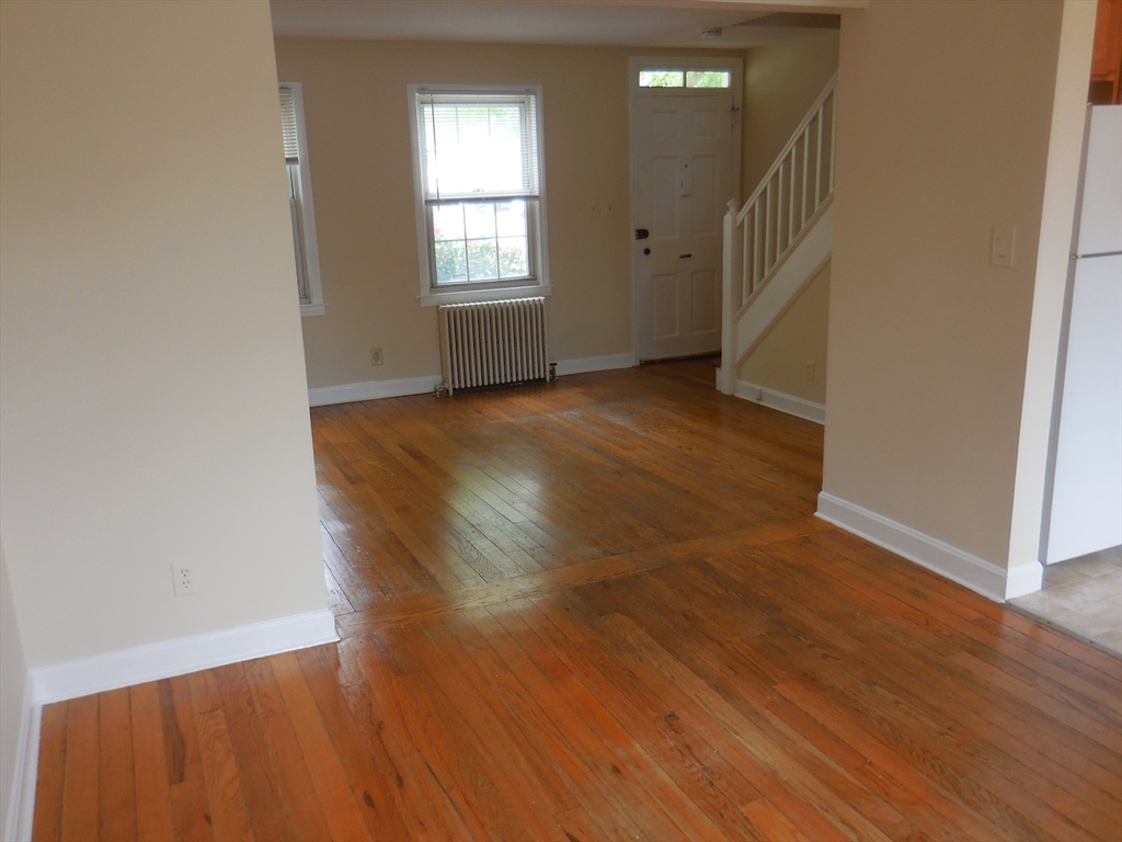6 Colony Road, Unit 6 West Springfield, MA 01089 - Photo 6 of 17 an empty room with wooden floor and windows