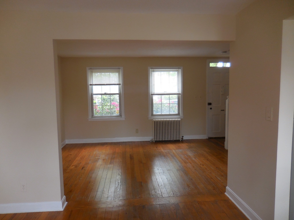 6 Colony Road, Unit 6 West Springfield, MA 01089 - Photo 7 of 17 an empty room with wooden floor and windows