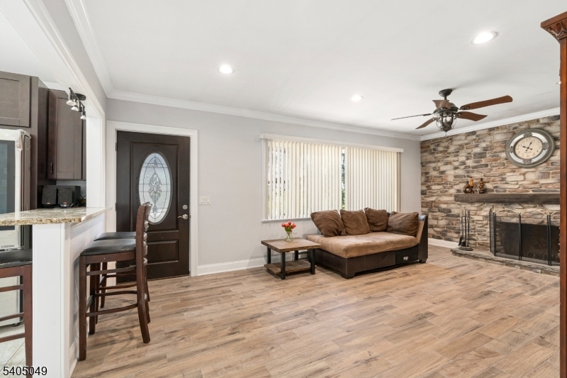 148 Highway 94 Vernon, NJ 07462 - Photo 12 of 33 a living room with furniture and a fireplace