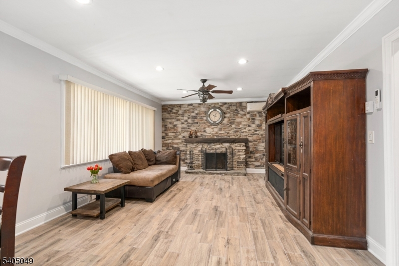148 Highway 94 Vernon, NJ 07462 - Photo 13 of 33 a living room with furniture a fireplace and a flat screen tv