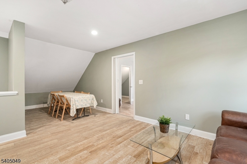 148 Highway 94 Vernon, NJ 07462 - Photo 19 of 33 a bedroom with a bed and wooden floor