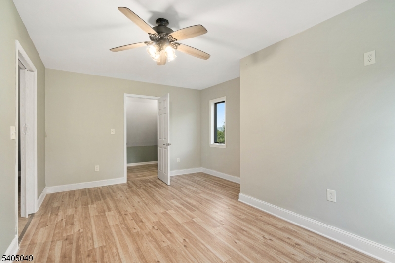 148 Highway 94 Vernon, NJ 07462 - Photo 22 of 33 wooden floor in an empty room with a window