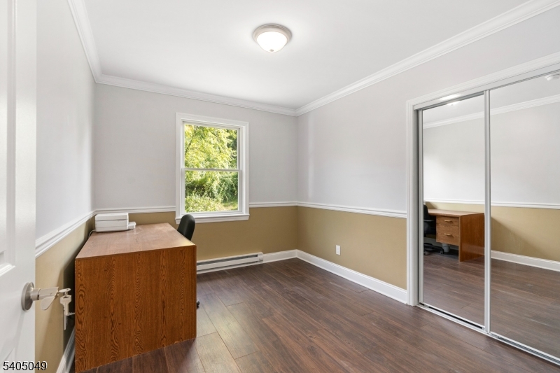 148 Highway 94 Vernon, NJ 07462 - Photo 26 of 33 an empty room with wooden floor and windows