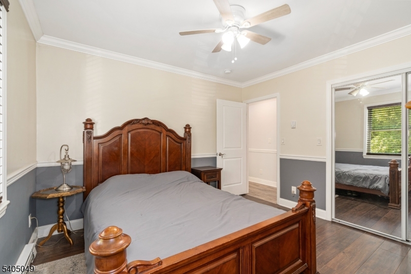 148 Highway 94 Vernon, NJ 07462 - Photo 29 of 33 a bedroom with a bed and a chandelier