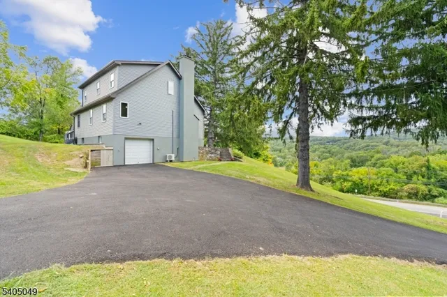 a view of a house with a yard and deck
