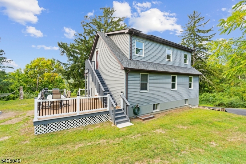 148 Highway 94 Vernon, NJ 07462 - Photo 32 of 33 a view of a house with a yard and deck