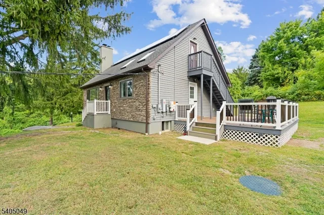 a view of yard with swimming pool and green space