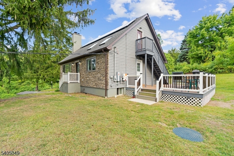 148 Highway 94 Vernon, NJ 07462 - Photo 9 of 33 a front view of a house with garden