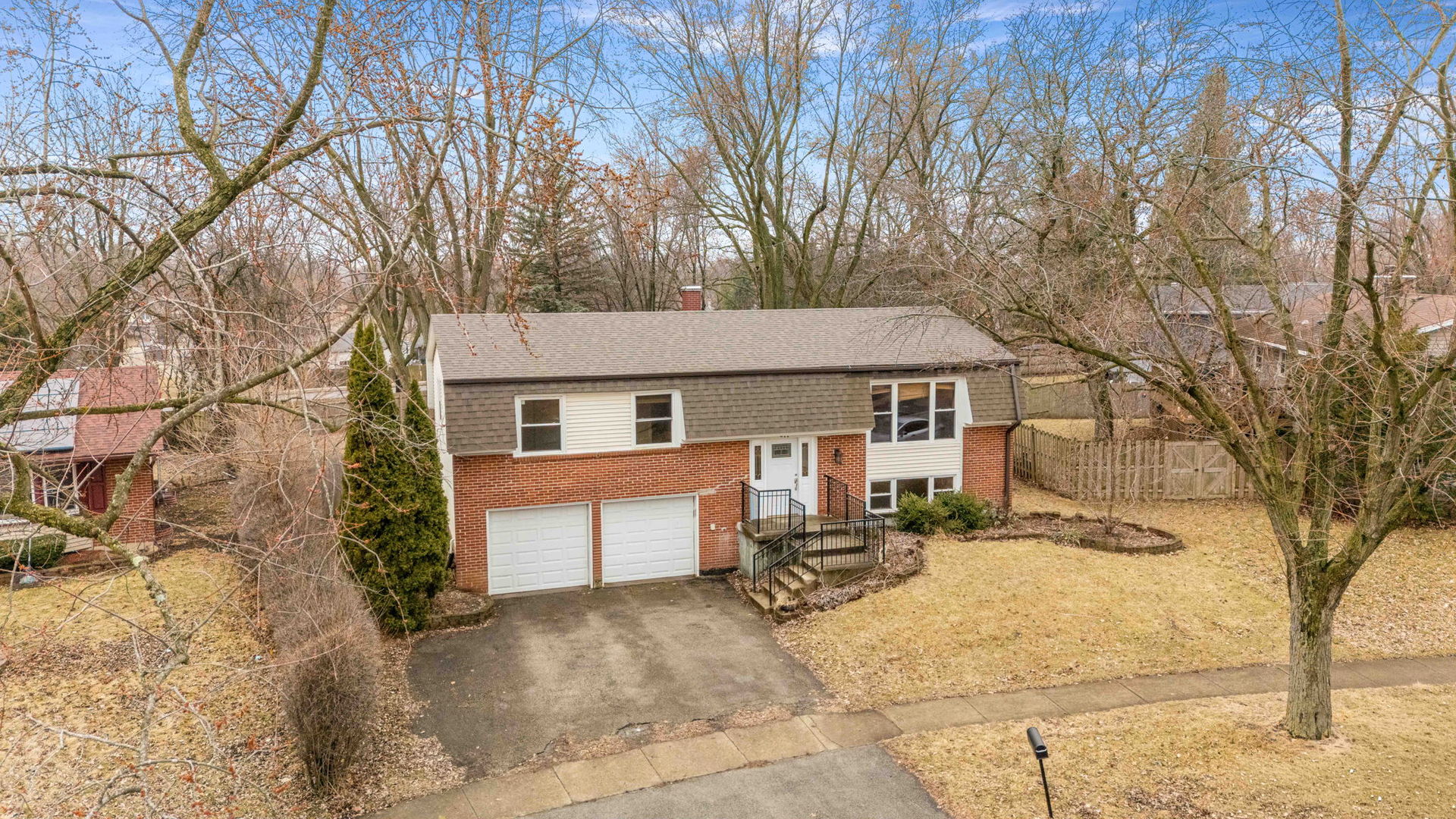 411 Assembly Drive Bolingbrook, IL 60440 - Photo 2 of 10 front view of a house with a large trees