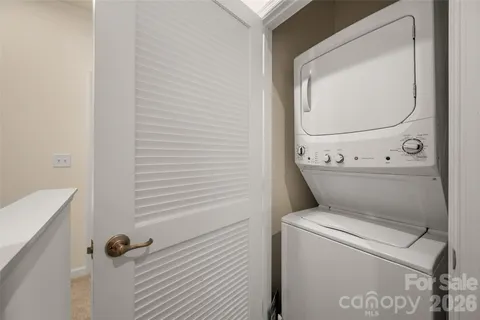 a view of bathroom with a washer and dryer