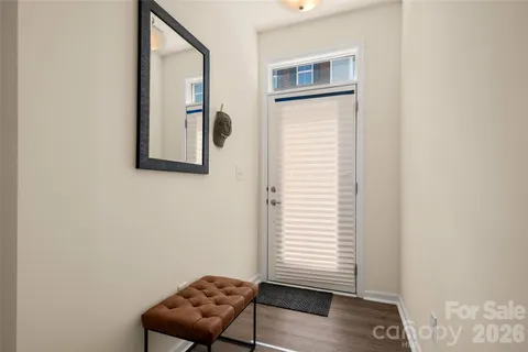 a view of a room with windows and cabinet
