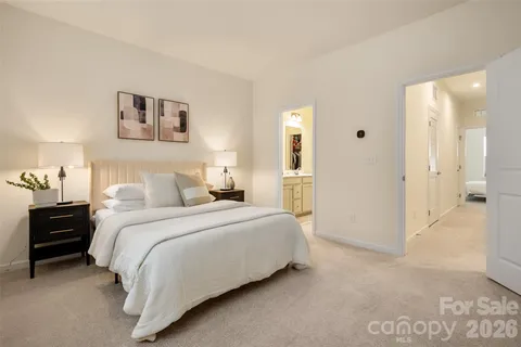 a bedroom with a bed and a view of bathroom