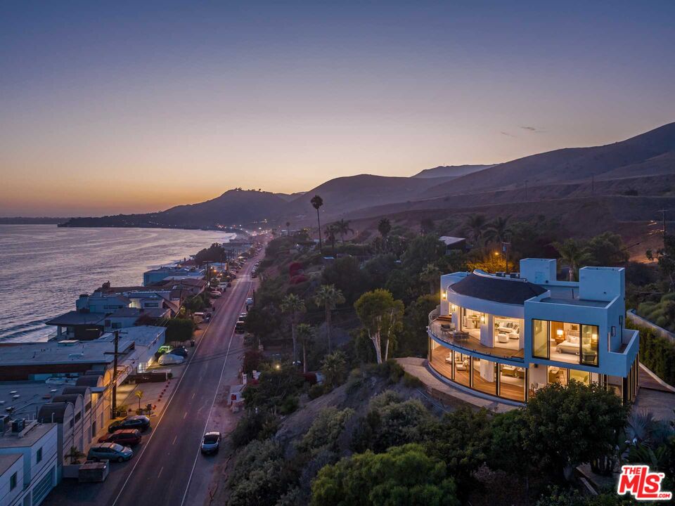 25225 Malibu Road Malibu, CA 90265 - Photo 1 of 23 an aerial view of a house with mountain view