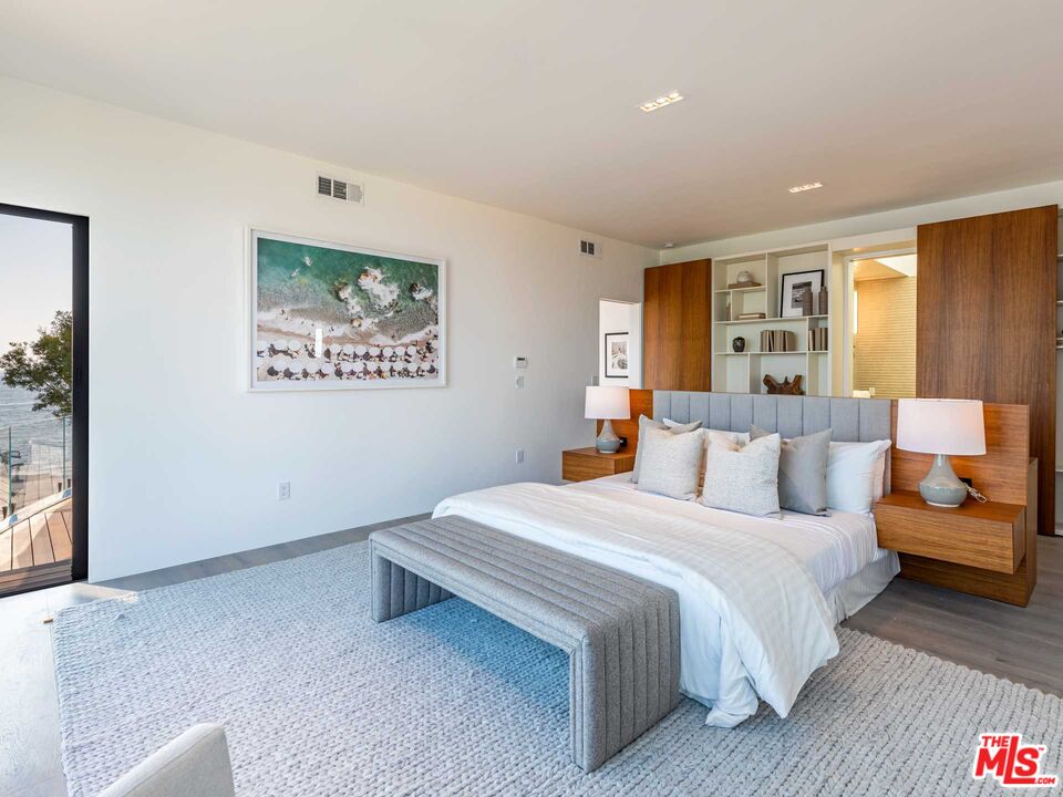 25225 Malibu Road Malibu, CA 90265 - Photo 14 of 23 a bedroom with a bed and a couch