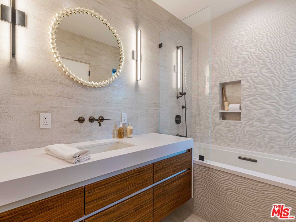 25225 Malibu Road Malibu, CA 90265 - Photo 18 of 23 a bathroom with a sink and a mirror