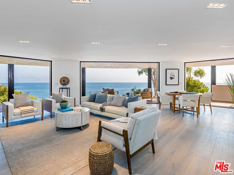 25225 Malibu Road Malibu, CA 90265 - Photo 4 of 23 a living room with furniture and a large window