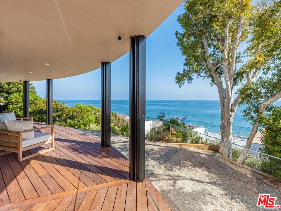 25225 Malibu Road Malibu, CA 90265 - Photo 7 of 23 a view of a room with wooden floor and wooden fence