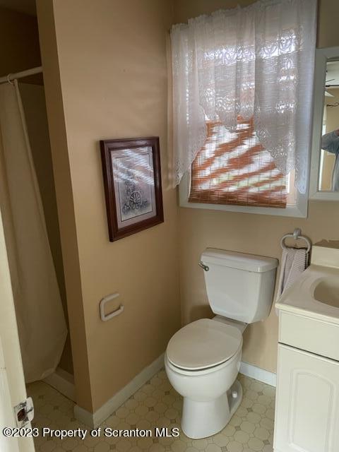 3511-3513 Winfield Avenue Moosic, PA 18507 - Photo 15 of 23 a bathroom with a toilet and a sink