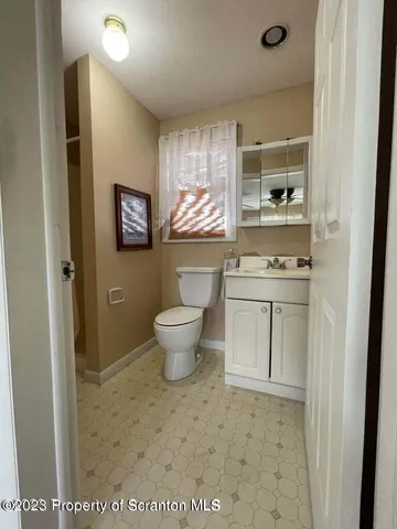 a room with stainless steel appliances a stove a sink and a refrigerator