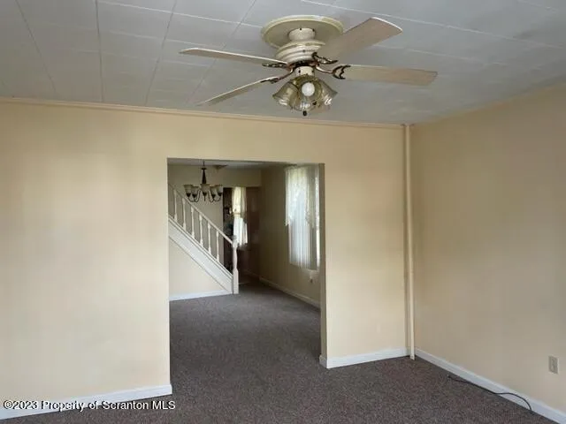 a view of a hallway with a chandelier