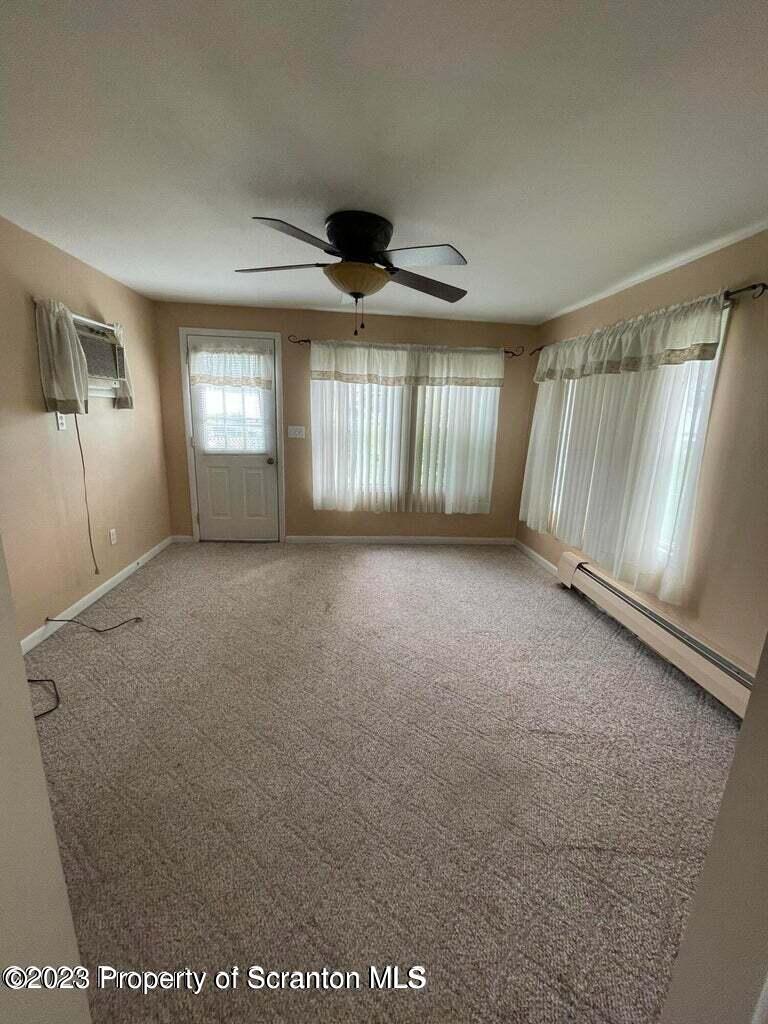 3511-3513 Winfield Avenue Moosic, PA 18507 - Photo 8 of 23 a view of an empty room with a window