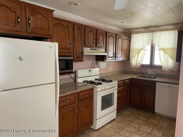 3511-3513 Winfield Avenue Moosic, PA 18507 - Photo 9 of 23 a kitchen with stainless steel appliances granite countertop a refrigerator a stove a sink dishwasher and a microwave