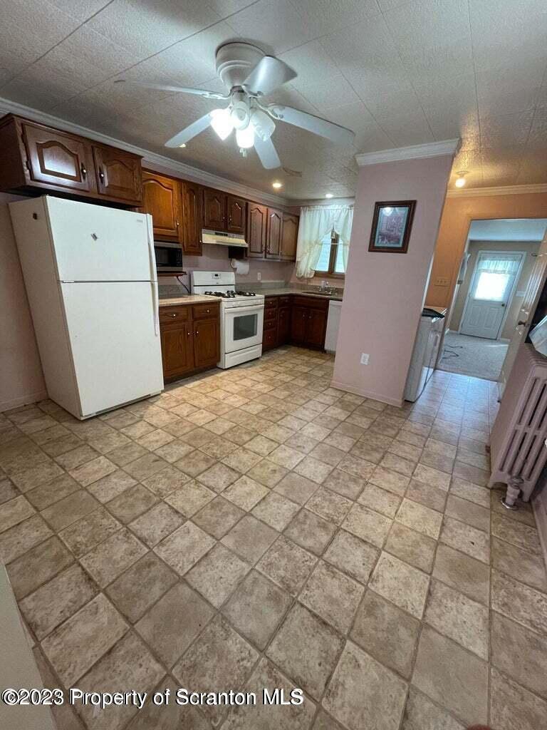 3511-3513 Winfield Avenue Moosic, PA 18507 - Photo 10 of 23 a view of a kitchen with a sink