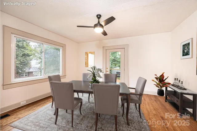 a view of a dining room with furniture window and outside view