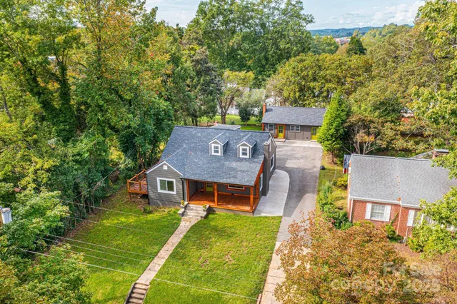 aerial view of a house with a big yard