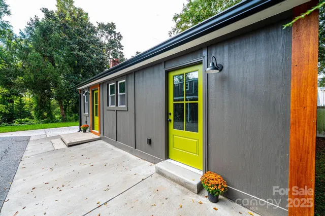 a kitchen with stainless steel appliances kitchen island a refrigerator sink and cabinets