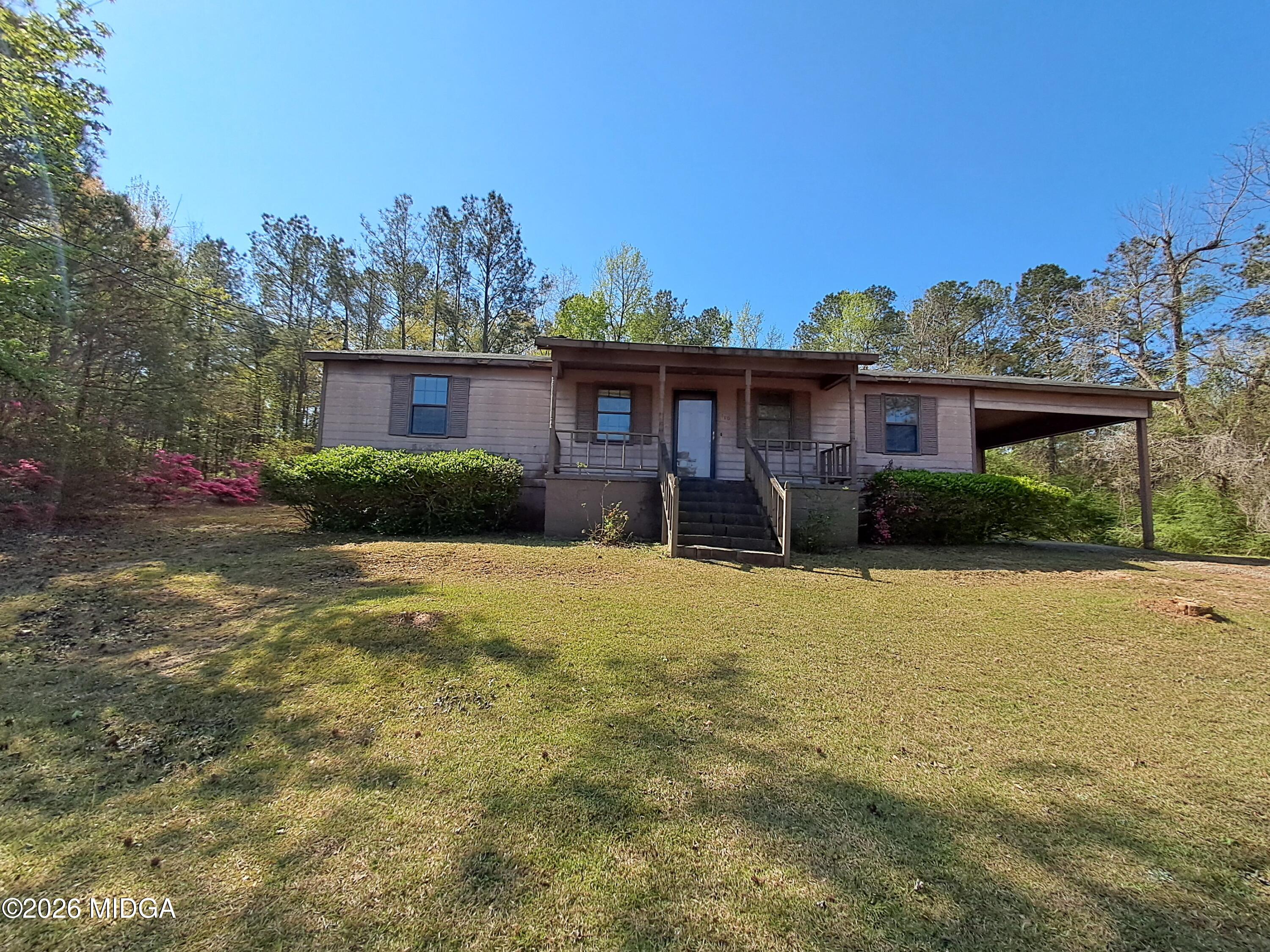 a front view of a house with garden