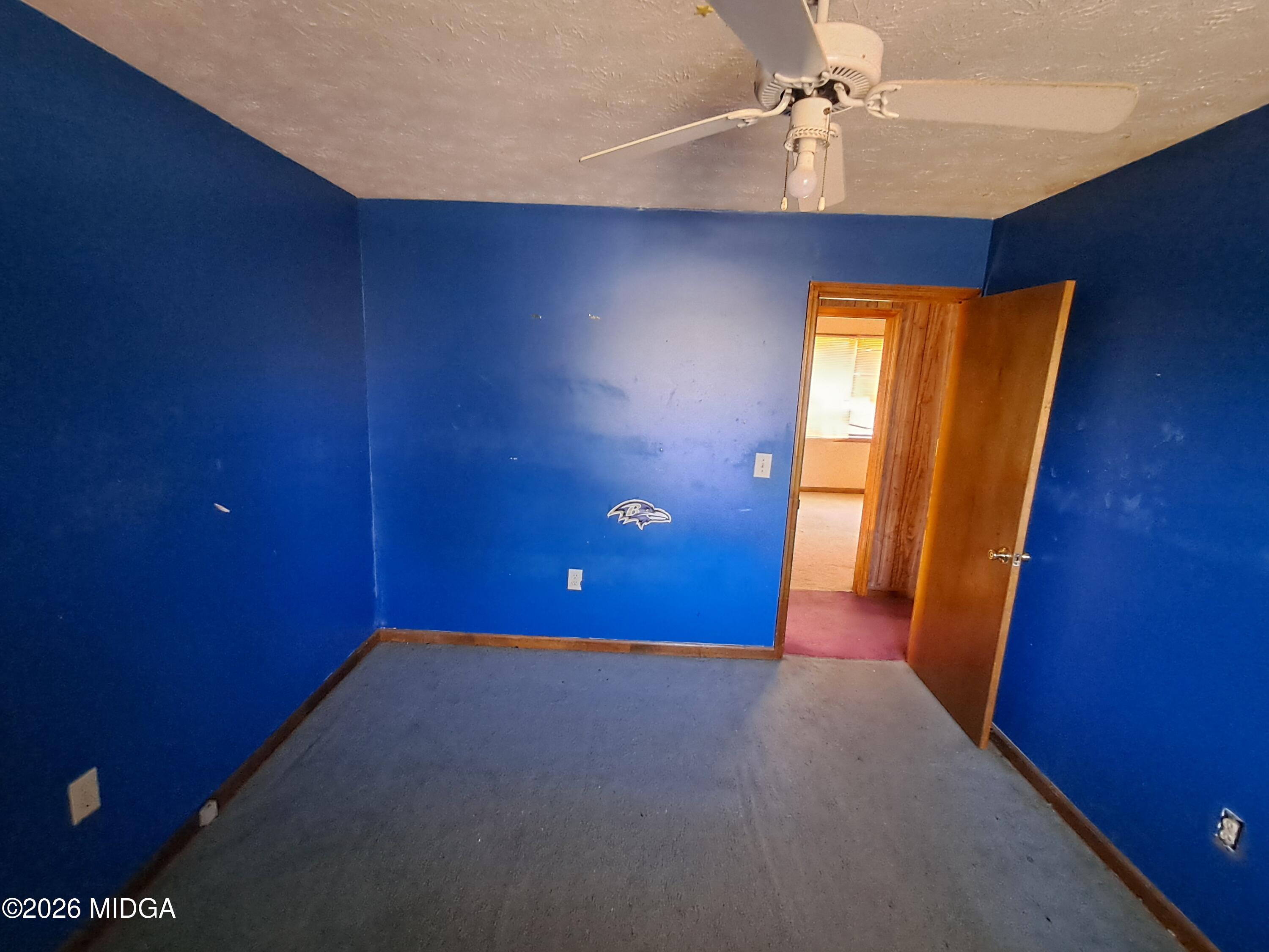 110 Irwinton Road Toomsboro, GA 31090 - Photo 11 of 17 a view of empty room with window